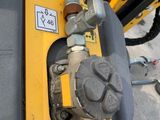 a close up of a machine with a hose attached to it
