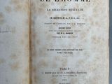 an old book opened to show the title of a novel