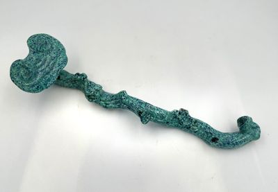 a close up of a metal hook with a heart on it