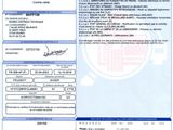 un gros plan d'un document sur lequel figure la photo d'une personne