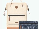 an image of a backpack and wallet sitting next to each other