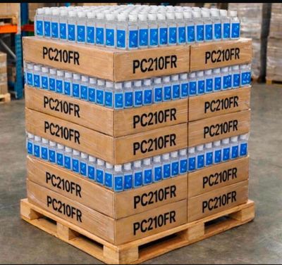 boxes of water are stacked on a pallet in a warehouse