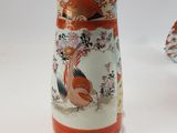 two vases that are sitting on a table
