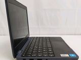 a black laptop with a blue keyboard on a white surface