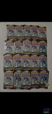 a close up of a pile of pokemon trading cards on a table