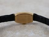 an image of a wrist watch with a gold plated case