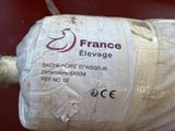 a roll of fabric wrapped in plastic on a table