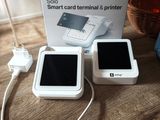 a white box with a picture of a cell phone and a charger