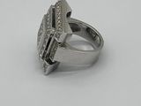 an image of a silver ring with diamonds on it on a white surface