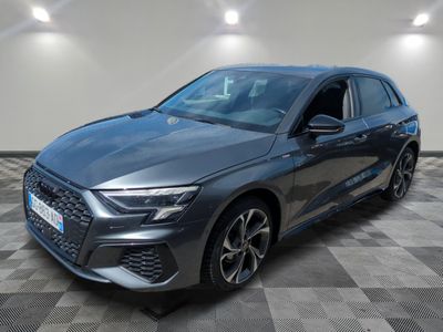 a grey audi q4 parked in a showroom