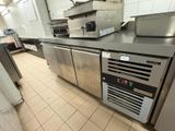 a kitchen with stainless steel appliances in it