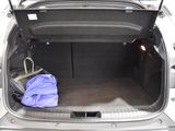 a car trunk with luggage in it and a bag in the back