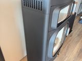 a television sitting on top of a black cabinet