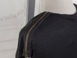a mannequin on a mannequin stand with a black top