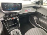the interior of a car with a steering control and dashboard controls
