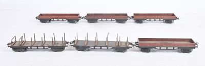 four train cars that are lined up on a white surface