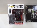 two star wars action figures sit side by side on a table