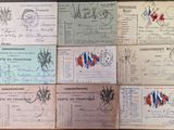 several old french postcards on a wooden table with a red, white, and blue design