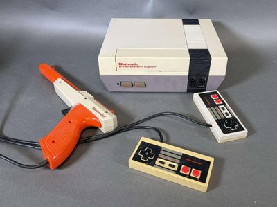 une image représentant une console Nintendo NES avec un pistolet et une manette