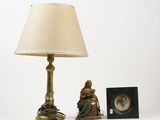 a lamp that is next to a picture of a woman