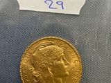 a close up of a gold coin with a label on it