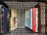 many books that are on a shelf in a book case
