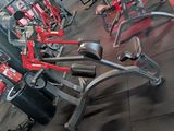 a row of exercise equipment in a gym room