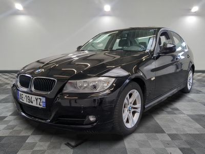 a picture of a black bmw car in a showroom