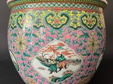 an image of a pink and green vase sitting on top of a table