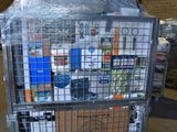 a large metal cage with a bunch of items inside of it
