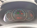 a close up of a car dashboard with a speedometer and gauges