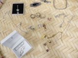a lot of jewelry sitting on the floor next to each other