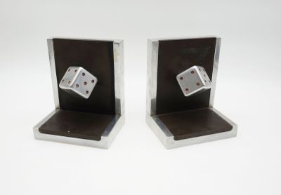 pair of metal dice bookends on a white background