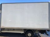 a white truck that is parked on the side of the road