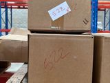 several boxes are stacked on a pallet in a warehouse
