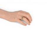 an image of a woman ' s hand with a gold ring on it