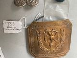 a picture of a belt buckle and other items on a table