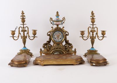 three different types of clocks on display on the table