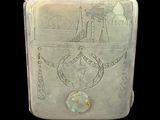 a silver cigarette case with a drawing on it