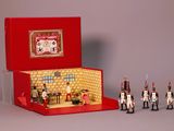 a red box with toy soldiers inside of it