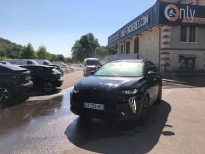 a black car parked in front of a building