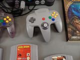 several video game controllers sitting next to each other on a table