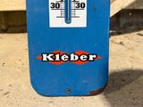 a blue sign with a thermometer on it that says kieber