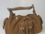 brown sued handbag with tassels and gold hardware
