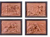four reliefs of nudes in a wood frame on a white background