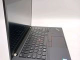 a laptop with a black keyboard on a white surface