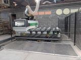 a machine that is working on a machine in a factory