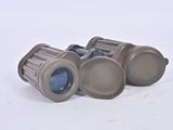 a pair of binoculars that are sitting on the ground