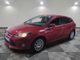 a red ford focus is parked on a checkered floor