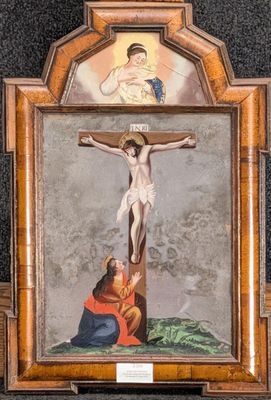 an image of a painting of jesus on the cross with a woman kneeling on the ground